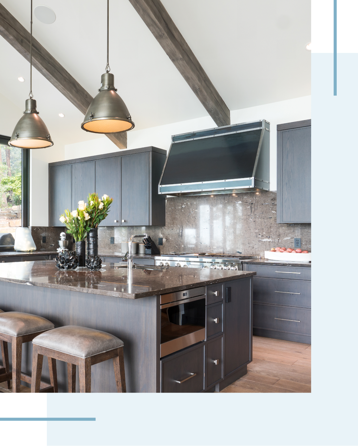 Modern kitchen with dark cabinets and island.