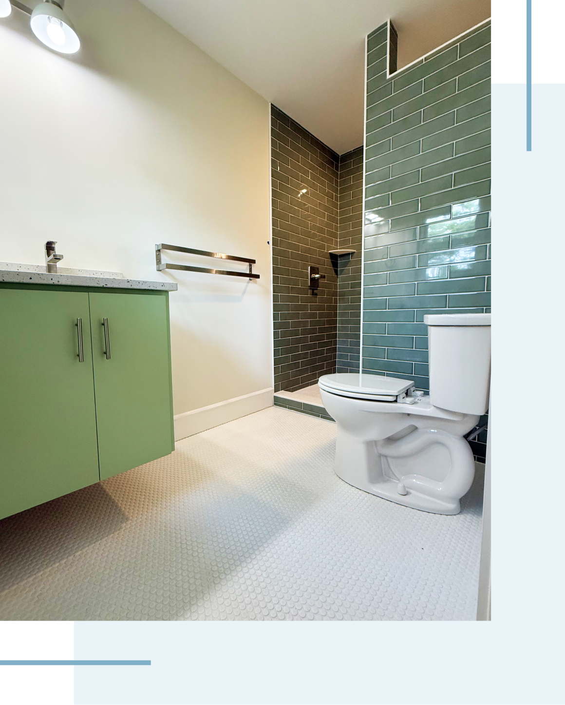 Modern bathroom with green tiles and fixtures.